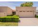 Charming single-story home with a two-car garage, desert landscaping, and tile roof at 8171 E Del Caverna Dr, Scottsdale, AZ 85258