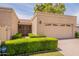Charming single-story home with a two-car garage, desert landscaping, and tile roof at 8171 E Del Caverna Dr, Scottsdale, AZ 85258
