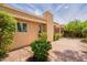 Exterior view of house with desert landscaping, stucco, and sky at 8171 E Del Caverna Dr, Scottsdale, AZ 85258