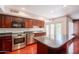 Modern kitchen featuring stainless steel appliances, an island, and ample cabinet space at 8171 E Del Caverna Dr, Scottsdale, AZ 85258