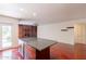 Open kitchen area with a large island, hardwood floors, and access to living room at 8171 E Del Caverna Dr, Scottsdale, AZ 85258