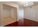 Open-concept home with hardwood floors, decorative lighting, and adjoining carpeted room at 8171 E Del Caverna Dr, Scottsdale, AZ 85258