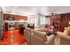 Open-concept living area with hardwood floors, fireplace, and a spacious kitchen at 8171 E Del Caverna Dr, Scottsdale, AZ 85258