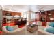 Open-concept living area with hardwood floors, fireplace, and a spacious kitchen at 8171 E Del Caverna Dr, Scottsdale, AZ 85258