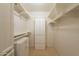 Spacious walk-in closet features built in shelving and multiple storage options to maximize space at 8171 E Del Caverna Dr, Scottsdale, AZ 85258