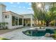 Inviting backyard pool area showcasing desert landscaping and a covered patio ideal for enjoying the outdoors at 8196 E Sunnyside Dr, Scottsdale, AZ 85260