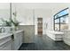 Luxurious bathroom featuring dual vanities, a soaking tub, and a walk-in shower at 8196 E Sunnyside Dr, Scottsdale, AZ 85260