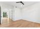 Bright bedroom with hardwood floors, a ceiling fan, and a walk-in closet at 8196 E Sunnyside Dr, Scottsdale, AZ 85260