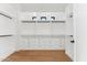 Organized closet with custom shelving, drawers, and hanging rods, offering ample storage space at 8196 E Sunnyside Dr, Scottsdale, AZ 85260