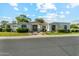 Beautiful single-story home with a red tile roof, manicured front yard, and black trimmed windows at 8196 E Sunnyside Dr, Scottsdale, AZ 85260