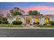 Inviting front exterior featuring a well-maintained lawn and a charming entryway at 8196 E Sunnyside Dr, Scottsdale, AZ 85260