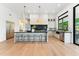 Spacious open kitchen with a large island, modern appliances, and hardwood floors at 8196 E Sunnyside Dr, Scottsdale, AZ 85260