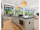 Bright kitchen with a large island, modern appliances, and light wood flooring at 8196 E Sunnyside Dr, Scottsdale, AZ 85260