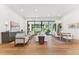 Bright open-concept living space combines seating and dining areas with views of the landscaped outdoors at 8196 E Sunnyside Dr, Scottsdale, AZ 85260