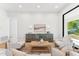 Living room with stylish decor, neutral tones, and a modern console, perfect for relaxation and entertaining at 8196 E Sunnyside Dr, Scottsdale, AZ 85260