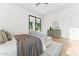 Main bedroom with a comfortable seating area, dresser, and large sliding glass doors at 8196 E Sunnyside Dr, Scottsdale, AZ 85260