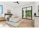 Spacious main bedroom with large sliding glass doors offering a view of the backyard at 8196 E Sunnyside Dr, Scottsdale, AZ 85260