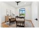 Office space with hardwood floors, a large window, and stylish furnishings at 8196 E Sunnyside Dr, Scottsdale, AZ 85260