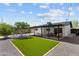 A spacious backyard with a lush lawn, gravel area, and covered patio, perfect for entertaining at 8732 E Arlington Rd, Scottsdale, AZ 85250