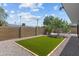 This grassy backyard offers a nice outdoor lounge area for relaxation and entertainment at 8732 E Arlington Rd, Scottsdale, AZ 85250