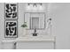 Contemporary bathroom showcases a black mirror and decor over the sink at 8732 E Arlington Rd, Scottsdale, AZ 85250