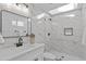 Sleek bathroom with marble tile, glass shower, and modern fixtures at 8732 E Arlington Rd, Scottsdale, AZ 85250