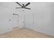Neutral bedroom features a ceiling fan and closet with sliding doors at 8732 E Arlington Rd, Scottsdale, AZ 85250