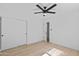 Clean, well lit bedroom boasts a ceiling fan and closet with sliding doors at 8732 E Arlington Rd, Scottsdale, AZ 85250
