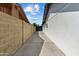 The long driveway provides ample parking space, while surrounded by walls and lush greenery at 8732 E Arlington Rd, Scottsdale, AZ 85250