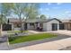 Charming single-story home with modern updates and a well-manicured front yard at 8732 E Arlington Rd, Scottsdale, AZ 85250