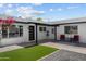 Charming home featuring modern design, lush landscaping, and inviting front entrance at 8732 E Arlington Rd, Scottsdale, AZ 85250