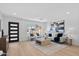 Bright living room featuring modern decor, a large window, and stylish furniture at 8732 E Arlington Rd, Scottsdale, AZ 85250