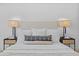 Comfortable main bedroom with plush bedding and stylish nightstands with lamps at 8732 E Arlington Rd, Scottsdale, AZ 85250