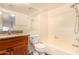 Well-lit bathroom with a granite vanity and shower over tub at 930 N Mesa Dr # 1023, Mesa, AZ 85201