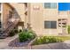 Well-maintained condo building featuring private entrances, desert landscaping, and staircase access at 930 N Mesa Dr # 1023, Mesa, AZ 85201