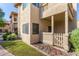 Charming condo exterior with a cozy porch, a picket fence, and attractive landscaping at 930 N Mesa Dr # 1023, Mesa, AZ 85201