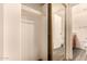Hallway closet with mirrored doors offers access to a bathroom at 930 N Mesa Dr # 1023, Mesa, AZ 85201