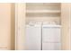 A laundry closet with a side-by-side washer and dryer at 930 N Mesa Dr # 1023, Mesa, AZ 85201