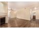 Bright living area with fireplace, wood floors, neutral paint, and open layout at 930 N Mesa Dr # 1023, Mesa, AZ 85201