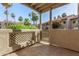 A quaint patio with tile flooring and a view of the landscaping at 930 N Mesa Dr # 1023, Mesa, AZ 85201