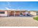 Covered patio features brick wall, small window, and sliding glass door at 9639 W Cinnabar Ave # A, Peoria, AZ 85345