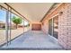 Covered patio features concrete floor, brick wall, and view to neighborhood at 9639 W Cinnabar Ave # A, Peoria, AZ 85345