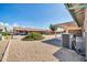 Backyard area with low maintenance landscaping and air conditioning unit at 9639 W Cinnabar Ave # A, Peoria, AZ 85345