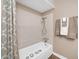 Bathroom with beige color scheme with bathtub and towel rack at 9639 W Cinnabar Ave # A, Peoria, AZ 85345