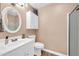 Bathroom featuring white cabinets, oval mirror, and neutral paint at 9639 W Cinnabar Ave # A, Peoria, AZ 85345