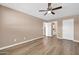 Spacious bedroom with hardwood floors and ensuite bathroom, ample natural light at 9639 W Cinnabar Ave # A, Peoria, AZ 85345