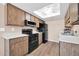 A traditional kitchen featuring wood cabinets and modern appliances at 9639 W Cinnabar Ave # A, Peoria, AZ 85345