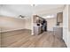 Bright kitchen and living room with modern appliances and sleek hardwood flooring at 9639 W Cinnabar Ave # A, Peoria, AZ 85345