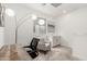 Bright bedroom with a desk, cozy chair, and soft carpet at 9901 E Tamery Ave, Mesa, AZ 85212