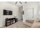 Spare room featuring a TV, storage, and soft carpet at 9901 E Tamery Ave, Mesa, AZ 85212